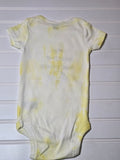 Hand dyed yellow baby bodysuit.  My brother has paws.