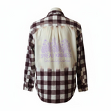 Flannel shirt with embroidered design on a white background