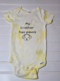 Hand dyed yellow baby bodysuit.  My brother has paws.