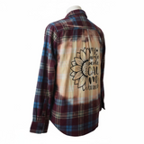 Plaid shirt with sunflower design and text on a white background