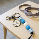 Dog leash with a keychain on a table